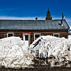 TippiePics > 019
 Elk Avenue
CB Life

It still cracks me up how deep the snow is. People have to put their bikes on top of the snow banks to store them since there's no room on the road or in their yards. This house used to have a walkway about 2' taller - and the sides were 2' taller, too! Hanging over the door you see some Red Lady Prayer Flags. These are in support of keeping Red Lady Mountain free of molybdenum mining. More on that another time!